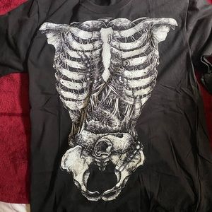Anvil print tee, nothing on back good quality shirt. M fits like a m-l